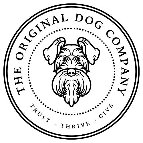 a picture of a logo for the original dog company. dog outline inside a circle